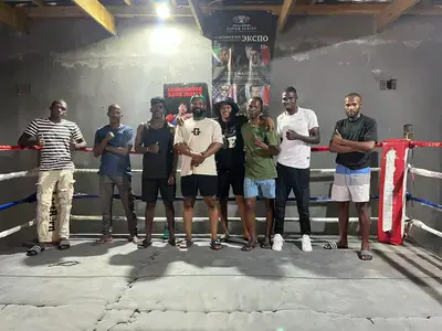 Lonki Witbooi with boxers at the All Winners Boxing Club before a training session following its reopening.
