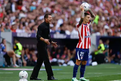 Atletico Madrid's Argentine coach Diego Simeone shouts instructions to his players.