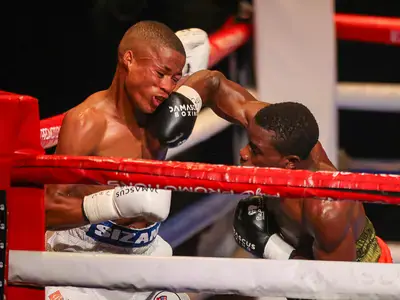 Errikie Errikie rocks Lonwabo Sizani with a big right during their WBC junior-lightweight title at the Guild Theatre.