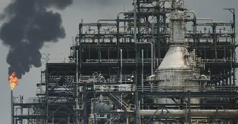 A flame rises from a gas flare at a refinery. Picture: REUTERS