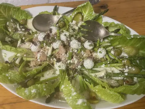 Tuna salad with asparagus, pear, green olives, gherkins and feta balls