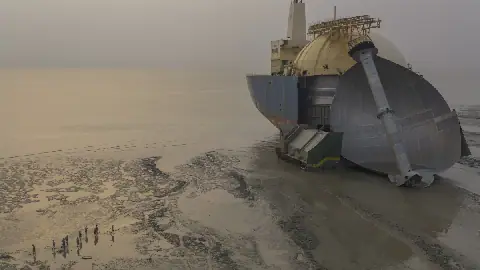 It's a mega-recycling effort: A crew of 60 men use blow torches and winches to break down a ship that had carried liquid natural gas. Tons of metal parts will be harvested to resell overseas. This photo by George Steinmetz, from the Bay of Bengal in Bangladesh, is the overall winner in the 2026 Siena Drone Photo Awards contest.